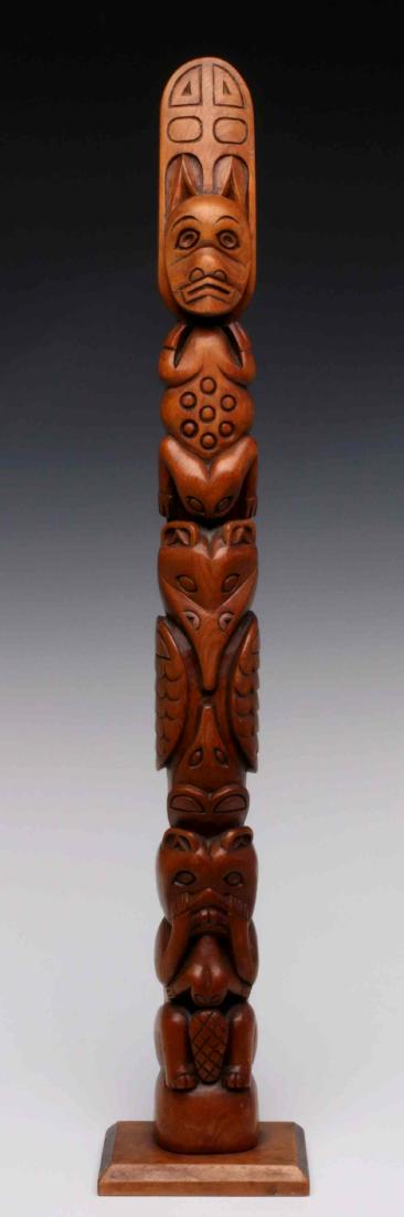 A 20TH CENTURY CARVED PINE WOOD TOTEM POLE: The origin is unknown. Measures 25 inches. We happily provide seamless in-house packing and shipping services on nearly everything we sell.