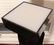 A BLACK ACRYLIC LIGHTED REVOLVING PEDESTAL - 2
