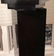 A BLACK ACRYLIC LIGHTED REVOLVING PEDESTAL - 3