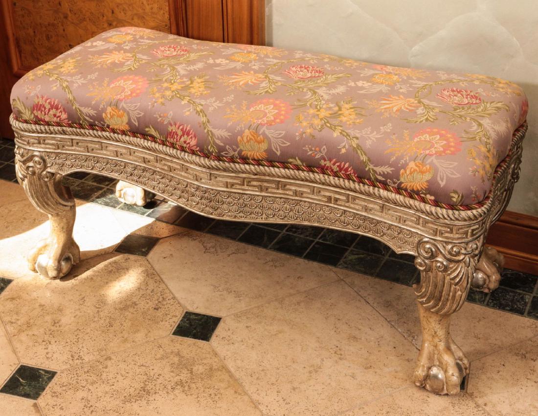 LATE 20TH CENTURY EMPIRE STYLE UPHOLSTERED BENCH: The serpentine form with ornate skirt, winged legs and large ball and claw feet. Plus three yards of home decor fabric. Measures 21 x 43.5 x 19 inches. Fabric measures 113 x 54 inches. Provenance: Spi