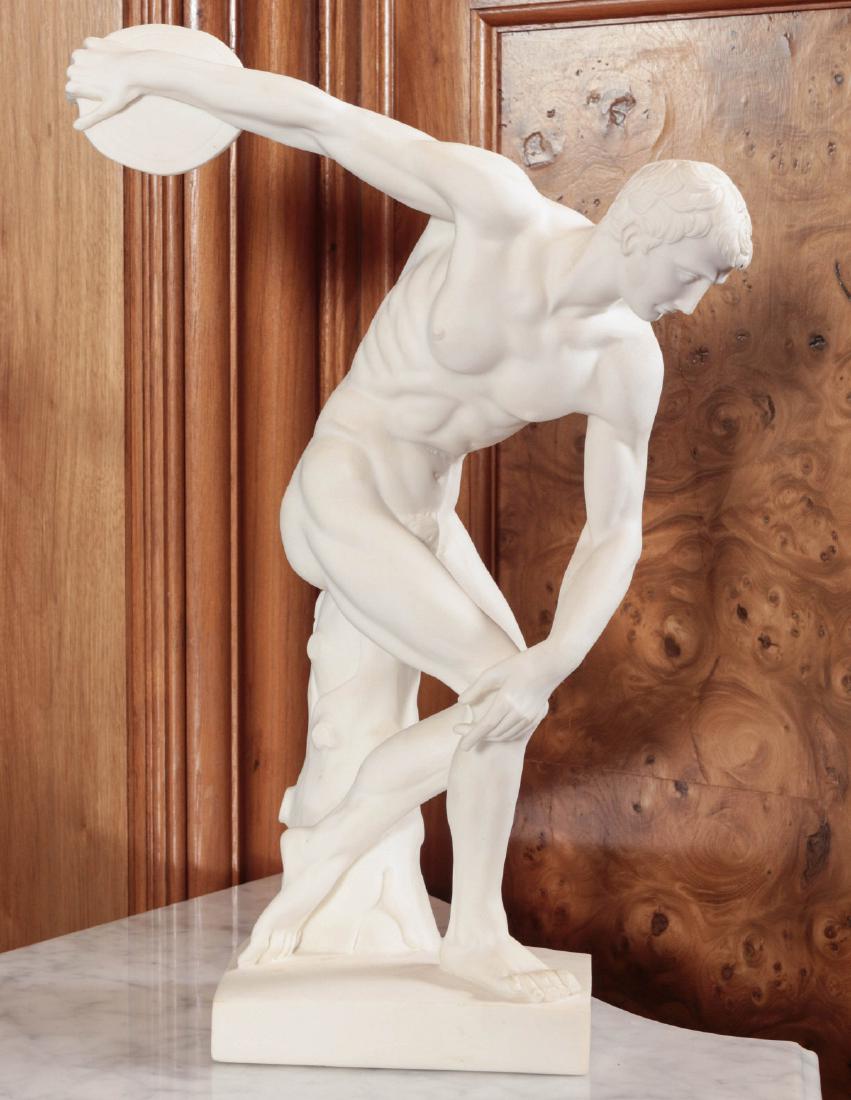 A DISCOBOLUS DISCUS THROWER FIGURE AFTER MYRON: The cast stone figure (alabaster powder and marble powder with resin) of the figure known as Discus Thrower, late 20th century. Measures 14.75 x 9.5 x 4 inches. Provenance: Spirit of Avalon Mansion an