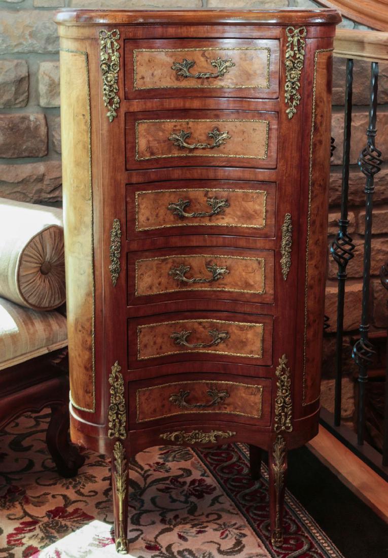 A FRENCH STYLE LINGERIE CHEST WITH ORMOLU AND BURL: The kidney shape form with walnut veneers, burled panels and ormolu mounts, late 20th century. Measures 43.5 x 22.25 x 14 inches. Provenance: Spirit of Avalon Mansion and Gardens, Lake Quivira, Kansas