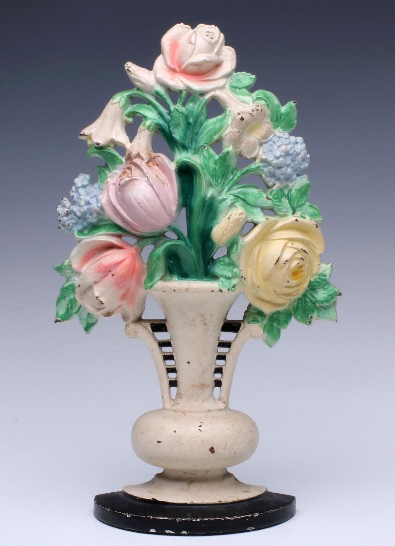 A NICE HUBLEY CAST IRON FLOWER BASKET DOORSTOP: The antique Hubley model signed in the casting back side of the base. Measures 10.5 x 6 x 2.25 inches. We happily provide seamless in-house packing and shipping services on nearly everything we sell.