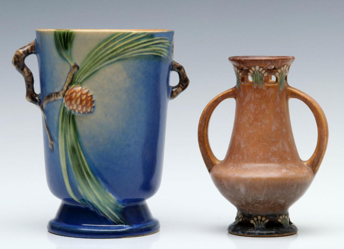 ROSEVILLE PINE CONE AND FERELLA ART POTTERY VASES: Circa 1930s. Two good middle period examples signed with foil stickers. Measure sizes range from 6.25 to 7.25 inches. We happily provide seamless in-house packing and shipping services on nearly every