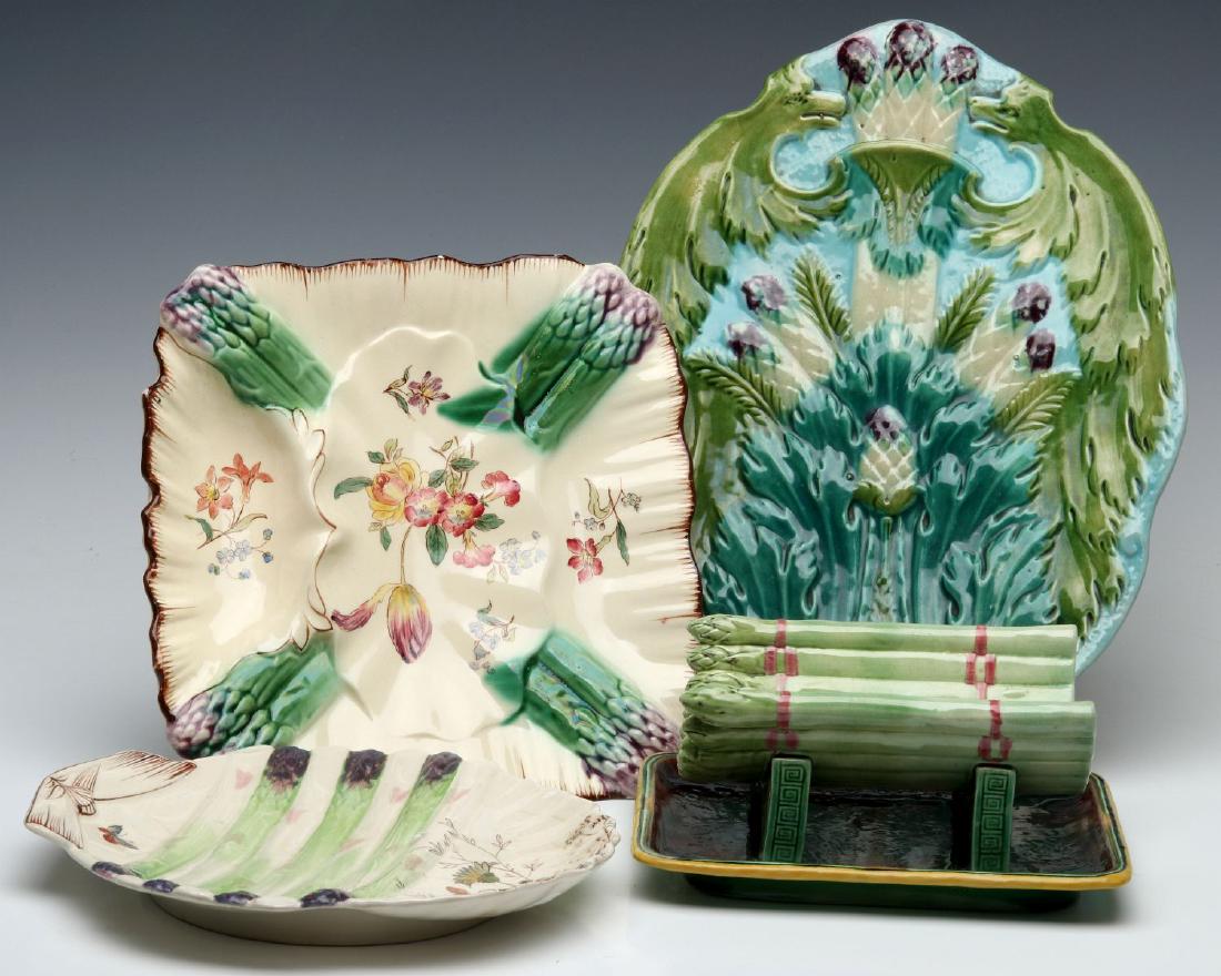 A COLLECTION OF FRENCH AND ENGLISH MAJOLICA: A William Adderley Floribel pattern tray, a large English tray with artichokes and asparagus; a squarish Longchamp plate with edge chip; three unsigned circular French majolica plates with wells at on