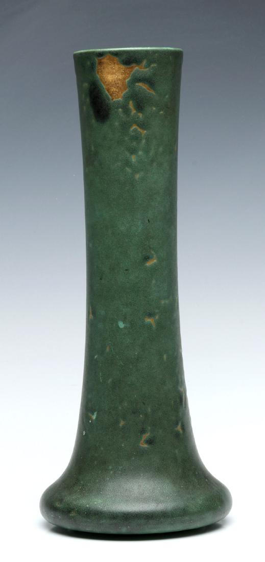 A TECO ART POTTERY MATTE GREEN VASE: An Arts and Crafts terra cotta vase with matte 'Teco Green' glaze, double impressed with the Teco mark, the curdled glaze shows yellow/tan terra cotta body. Measures 13.25 x 5.5 inches. We happily pro