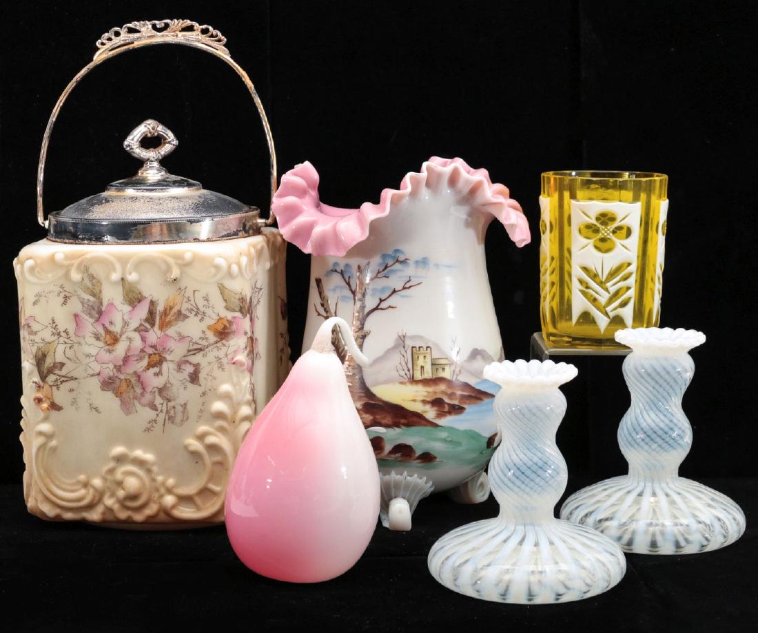 A COLLECTION OF VARIOUS VICTORIAN ART GLASS ITEMS: A C.F. Monroe Wavecrest cracker jar, a Peachblow art glass pear, a vase with ruffled edge and three curled feet, opalescent blown glass candle holders and a citron glass tumbler overlaid with white gl