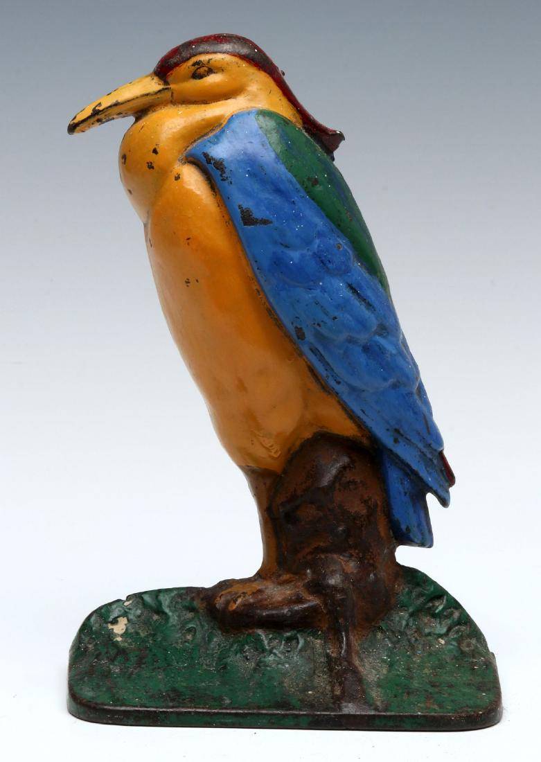AN ANTIQUE ALBANY FOUNDRY CAST IRON 'HERON' DOORSTOP: Circa 1926, a single-sided Heron doorstop, shape #83 made by Albany Foundry, polychrome painted finish. Measures 8 x 5 x 2.75 inches. We happily provide seamless in-house packing and shipping services