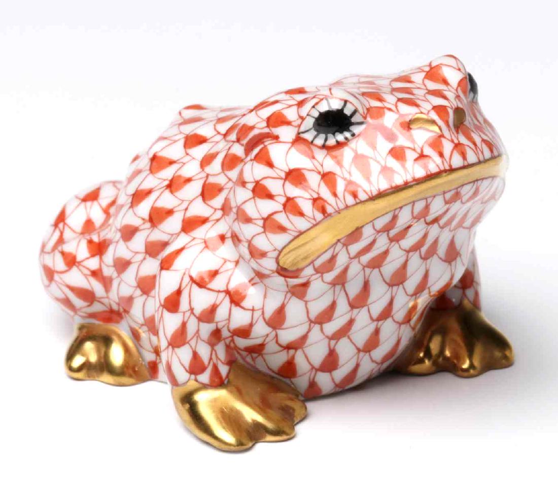 A HEREND RED FISH NET DECORATED TOAD / FROG: The hand painted decoration of rust red fishnet, signed on the base with a blue ink stamp. Measures 1.75 x 2 x 3 inches. We happily provide seamless in-house packing and shipping services on nearly ev