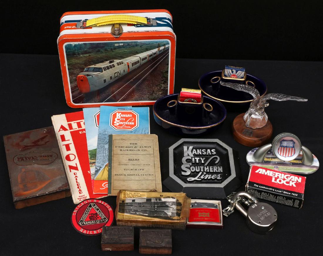 LOT OF KCS, MO PAC & MORE RAILROAD COLLECTIBLES: Kansas City Southern Lines time tables dated Oct. 1, 1950, Jan. 1, 1953; cast aluminum KCS desk ornament, CN tin lunchbox, two Missouri Pacific ashtrays in cobalt blue, Union Pacific desk clock, UP RR