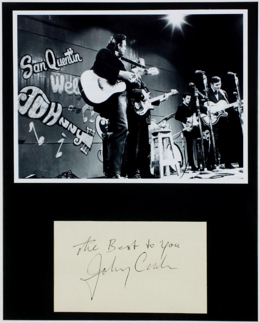 JOHNNY CASH SAN QUENTIN PHOTO AND AUTOGRAPH CLIP: Framed black and white photo over an autograph clip inscribed 'The Best to You Johnny Cash,' includes a letter of authenticity. The buyer of record has until September 1, 2019 to return this lot for f
