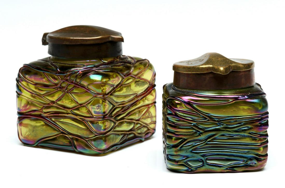 TWO VERY NICE AUSTRIAN THREADED GLASS INK WELLS: 1900 - 1920 The square glass forms of threaded iridescent art glass, each with hinged bronze cover and original fiery opal glass insert. Measure 2.25 x 2.25 and 2.75 x 2.5 inches. We happily provide s