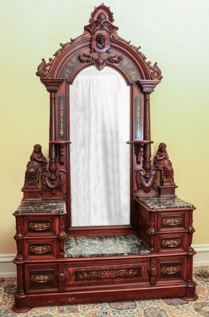 AN INLAID WALNUT DRESSER ATTR POTTIER & STYMUS: A good 19th century American Renaissance deep well dresser circa 1870, the arched mirror with lady's head and carved palmette crest, ebonized panels with marquetry inlay applied to the mirror frame an