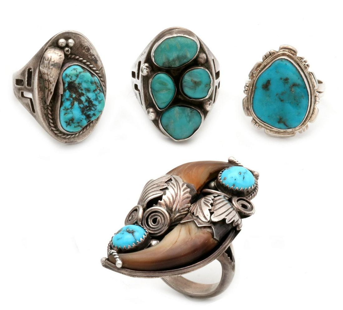 FOUR VINTAGE NAVAJO INDIAN STERLING AND TURQUOISE RINGS: 1. a bear claw ring signed DB for Navajo silversmith Dean Brown, 2. a Gent's ring with flat table and applied leaf beside a Sleeping Beauty mine nugget in bezel surrounded by twisted silver wire rope 