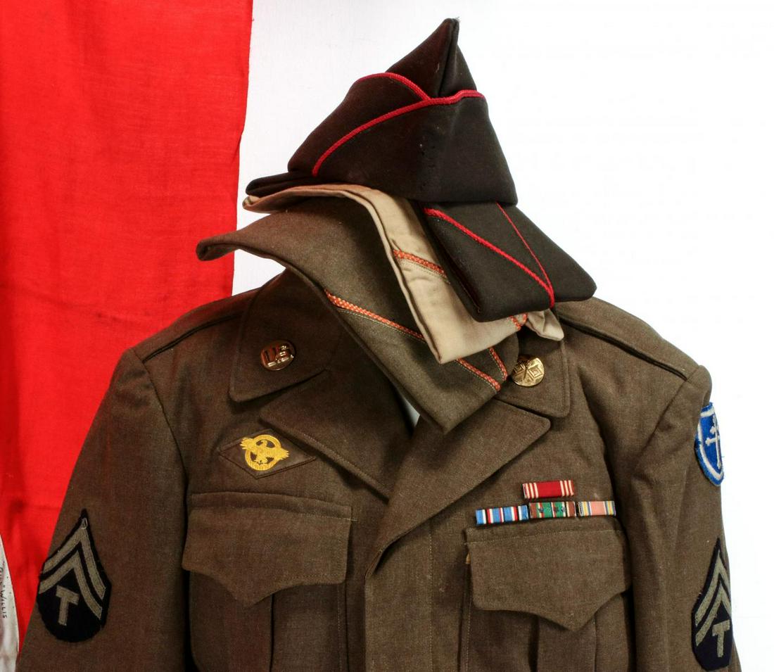 THE WWII SOUVENIR COLLECTION OF NORMAN PATTEE, US ARMY: A large and varied archive of souvenirs, captured souvenirs, photo albums, a large collection of photographs, Ike Jacket, dog tags, Combat History of the 79th Division (odor), third Reich banner signe