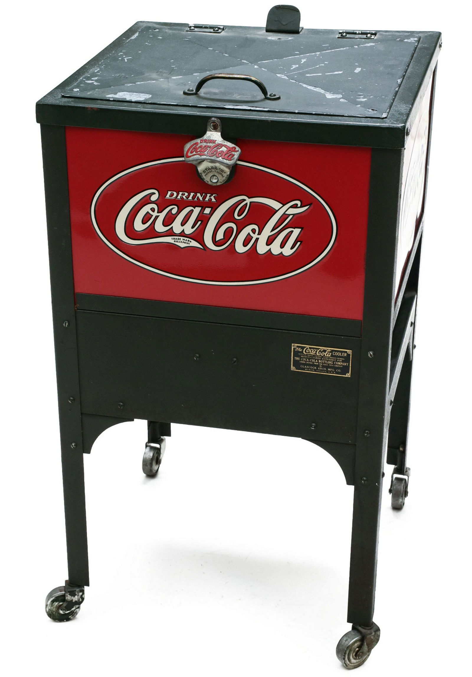 A 1930s GLASCOCK JUNIOR FLOOR STANDING COCA-COLA COOLER: The circa 1931 cooler, metal framework with four embossed three-color tin signs, bottle opener and a brass maker's tag with black enamel and patent date of 1930. Measures 30.5 x 17.5 x 19 inches. Prov