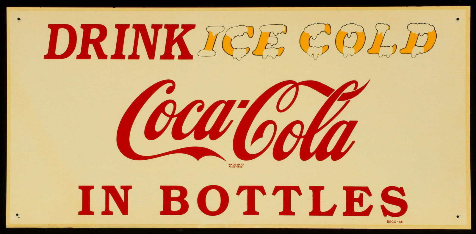A CIRCA 1948 TIN COCA-COLA ADVERTISING SIGN: 'Drink Ice Cold Coca-Cola in Bottles,' the four-color single sided sign with unusual yellow lettering glazed in ice, signed DSCO - 48 lower right. Sight size measures 10.75 x 23.25 with a frame of 11.