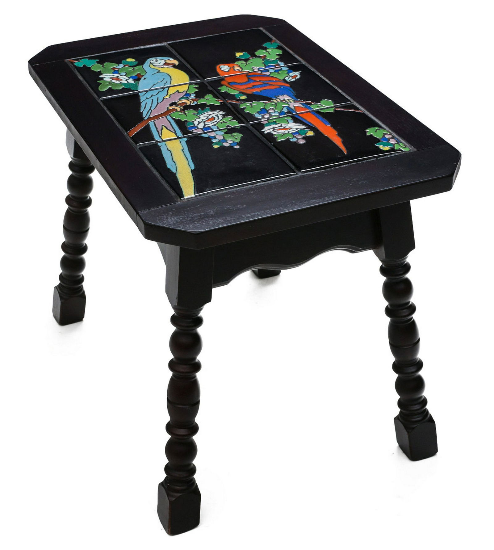 A BRIGHT TAYLOR CALIFORNIA TILE TOP TABLE WITH PARROTS: The colorful six-tile top creates the image of two parrots on leafy branches, displayed in the original wood table frame in original dark stain. Measures 18.25 x 16.25 x 24 inches. Provenance: The 45-