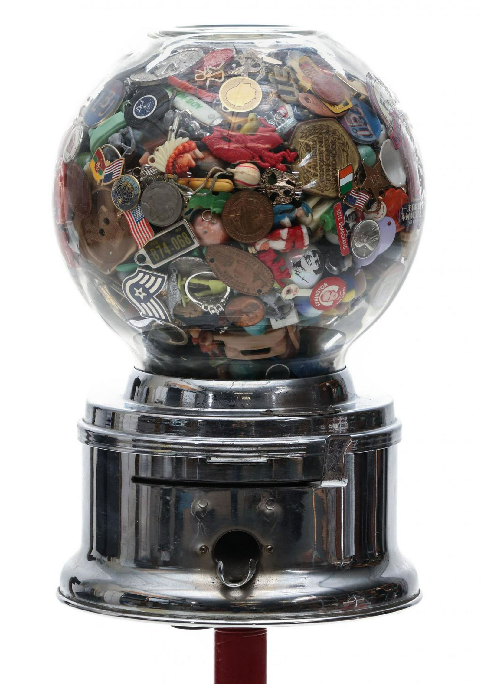 FORD 1 CENT GUMBALL MACHINE WITH 1000 COLLECTIBLES: The mid-20th century gumball vendor completely filled with collectibles and novelties of the period along with reproduction tokens, game pieces, pin-back buttons, advertising premiums, miniatures, ste