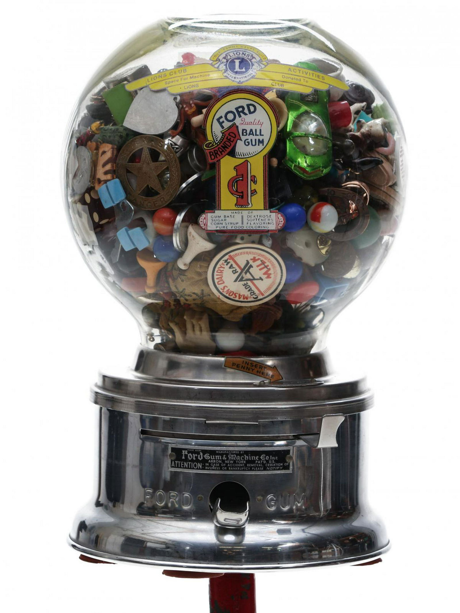 A MID 20TH C. GUMBALL MACHINE WITH 1000 COLLECTIBLES: Manufactured by Ford Gum and Machine Co Inc, and filled with collectibles and novelties of the period, such as tokens, game pieces, pin-back buttons, advertising premiums, miniatures, marbles and much