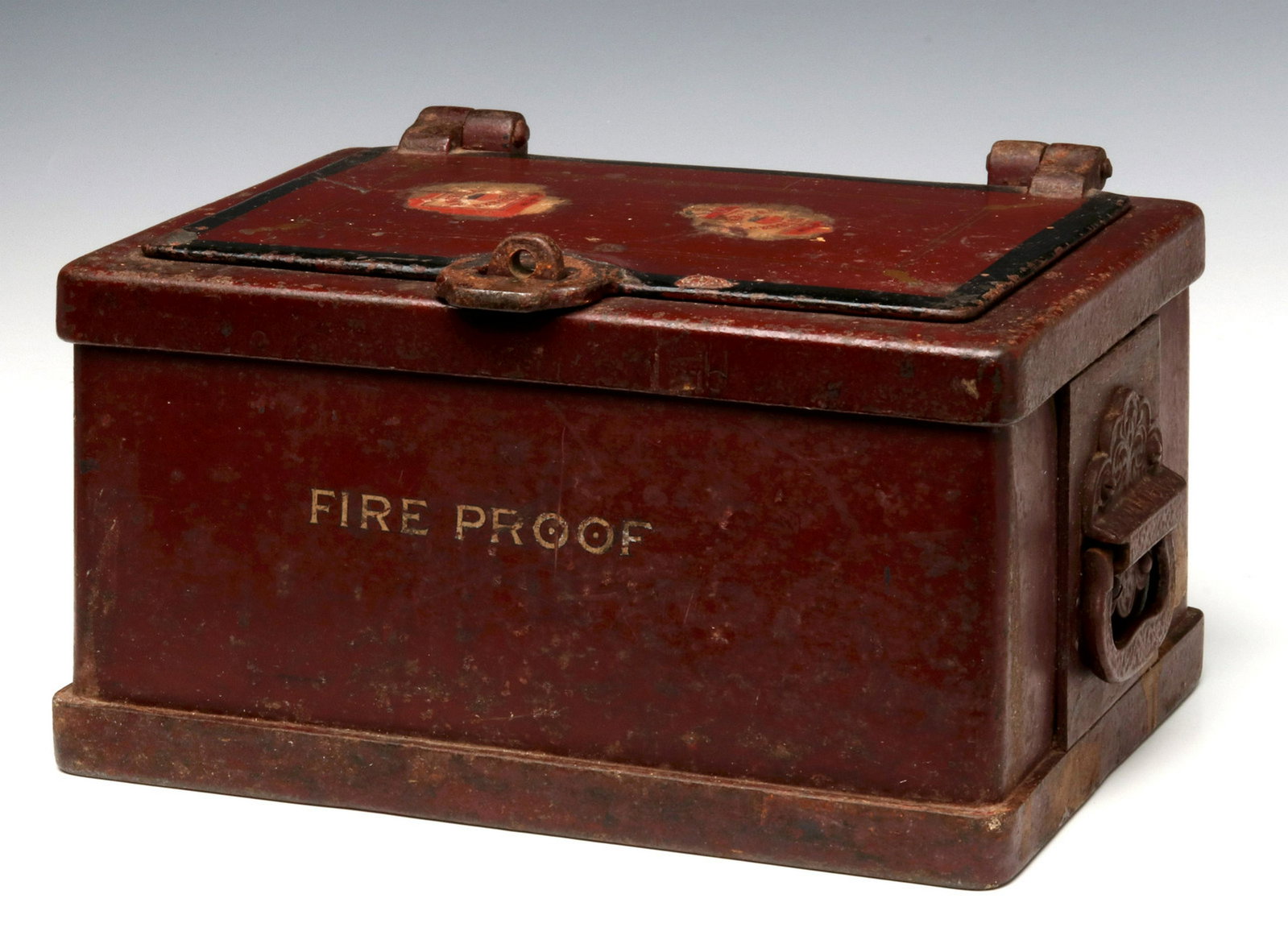 A SMALL 19TH C. VAULT WITH DECORATION AND 'FIRE PROOF': The small vault with hasp, pin striping on original red paint, black trim and ornate cast iron handles, lettered FIRE PROOF, two AMERICAN EXPRESS paper labels on the hinged lid. Measures 7.5 x 12.5 x 