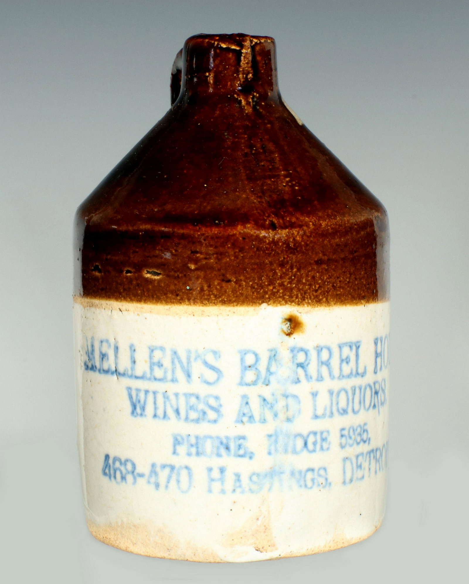 A MELLEN'S WINES AND LIQUORS DETROIT MINI STONEWARE JUG: A brown cone-top jug with bristol body lettered ALLEN'S BARREL HOUSE WINES AND LIQUORS, plus address and phone, circa 1900. Measures 3.5 x 2.25 inches. Provenance: The 45-year collection of Michael an