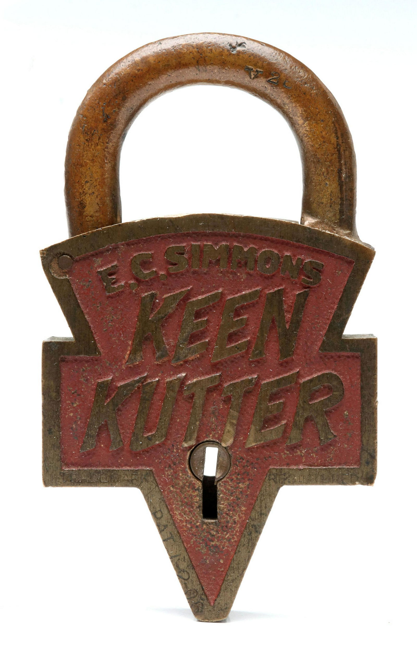 A TRUE CIRCA 1906 BRASS KEEN KUTTER LOGO PADLOCK: The classic logo lock stamped with Trademark information and patent date of 1 - 2- 06, original red paint, the original key. Measures 4 x 2.25 inches. Provenance: The 45-year collection of Michael and