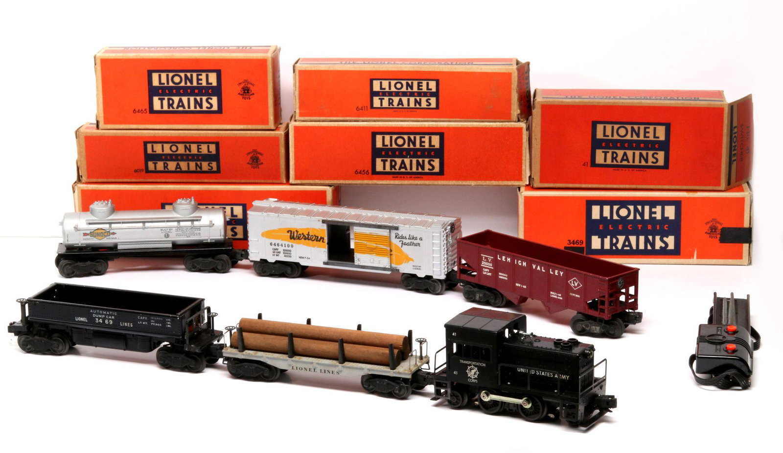 POSTWAR LIONEL TOY LOCOMOTIVE, CARS IN ORIGINAL BOXES: The Lionel locomotive United States Army Transportation Corps No. 41, no box, cars with boxes include: Flat Car No. 6411; Automatic Dumping Ore Car No. 3469; Red Hopper Car No. 6456; Western Pacific B