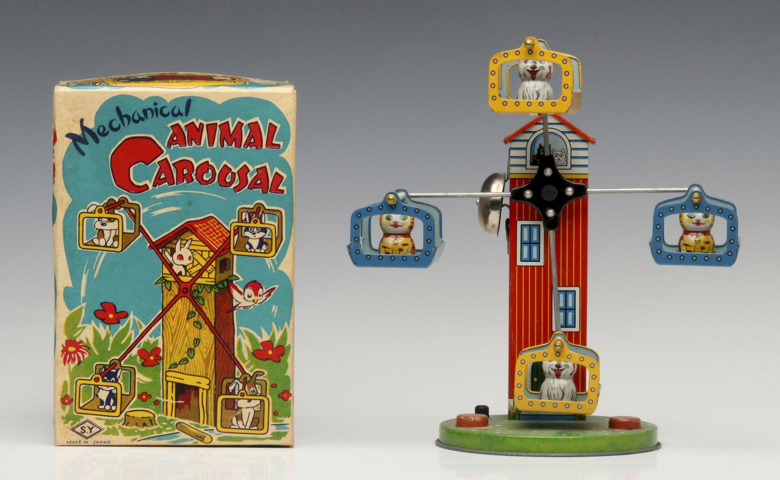 A MID 20TH CENT JAPANESE LITHOGRAPHED TIN WIND-UP TOY: The Mechanical Animal 'Carousal' in original box. Measures 8 inches. Provenance: The 45-year collection of Michael and Donna Hayes, West Plains, Missouri. We happily provide seamless in-house packing 