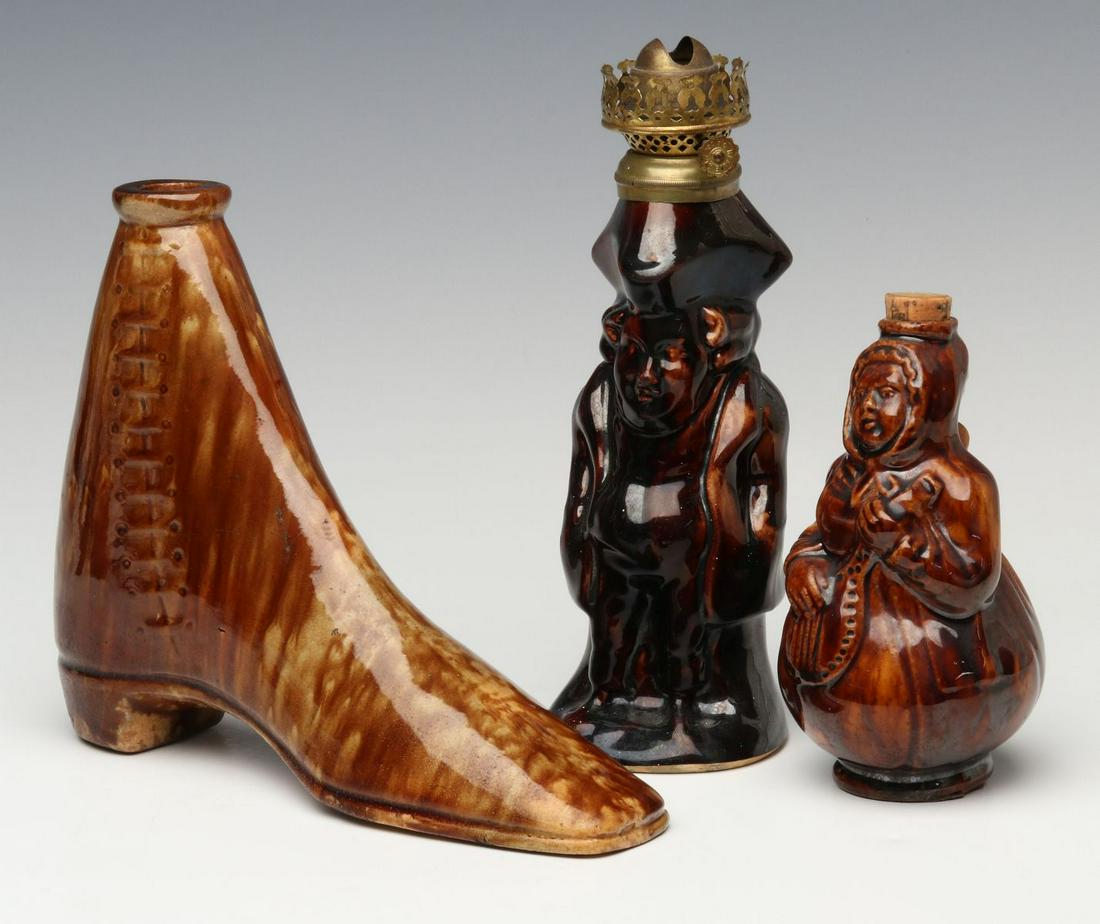 A GOOD 19TH C. FLINT ENAMEL GLAZE HIGH TOP SHOE FLASK: The high top shoe with a toby figural lamp and bottle in the form of woman with lute. Measure from 5.5 to 7.25 inches. Provenance: The 45-year collection of Michael and Donna Hayes, West Plains, Misso