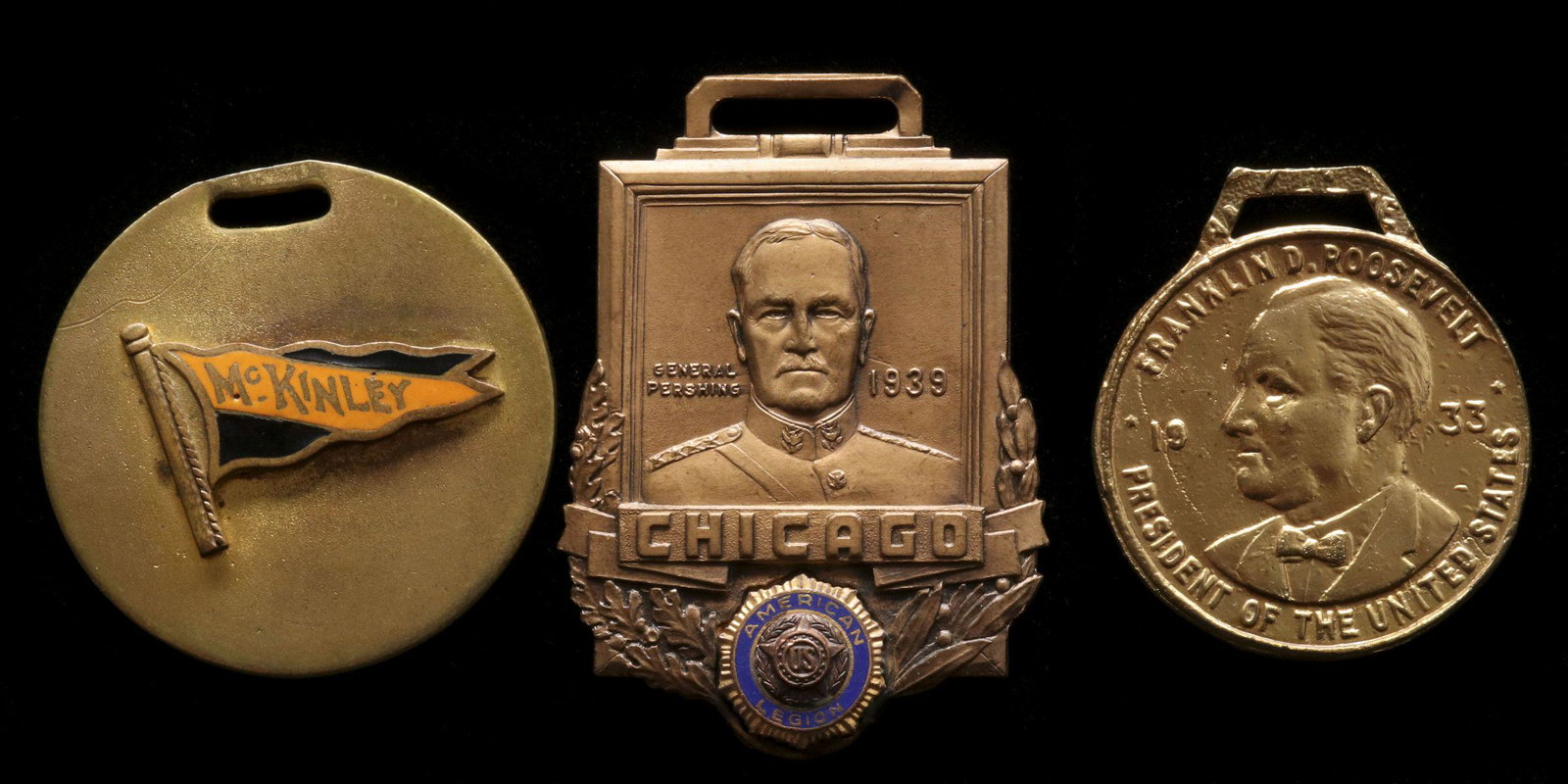 POLITICAL AND FRATERNAL WATCH FOBS CIRCA EARLY 20TH C.: The circular fob with Mckinley enameled pennant, General Pershing on an American Legion fob and FDR 1933 American Legion fob. Measures 1.375, 1.5 and 2 inches. Provenance: The 45-year collection of Mi