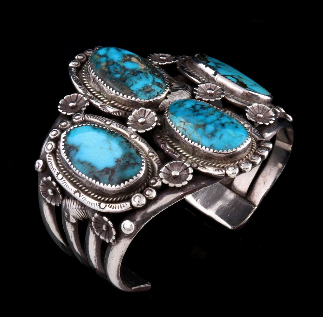 A NAVAJO STERLING AND TURQUOISE CLUSTER CUFF BRACELET (1 of 12)