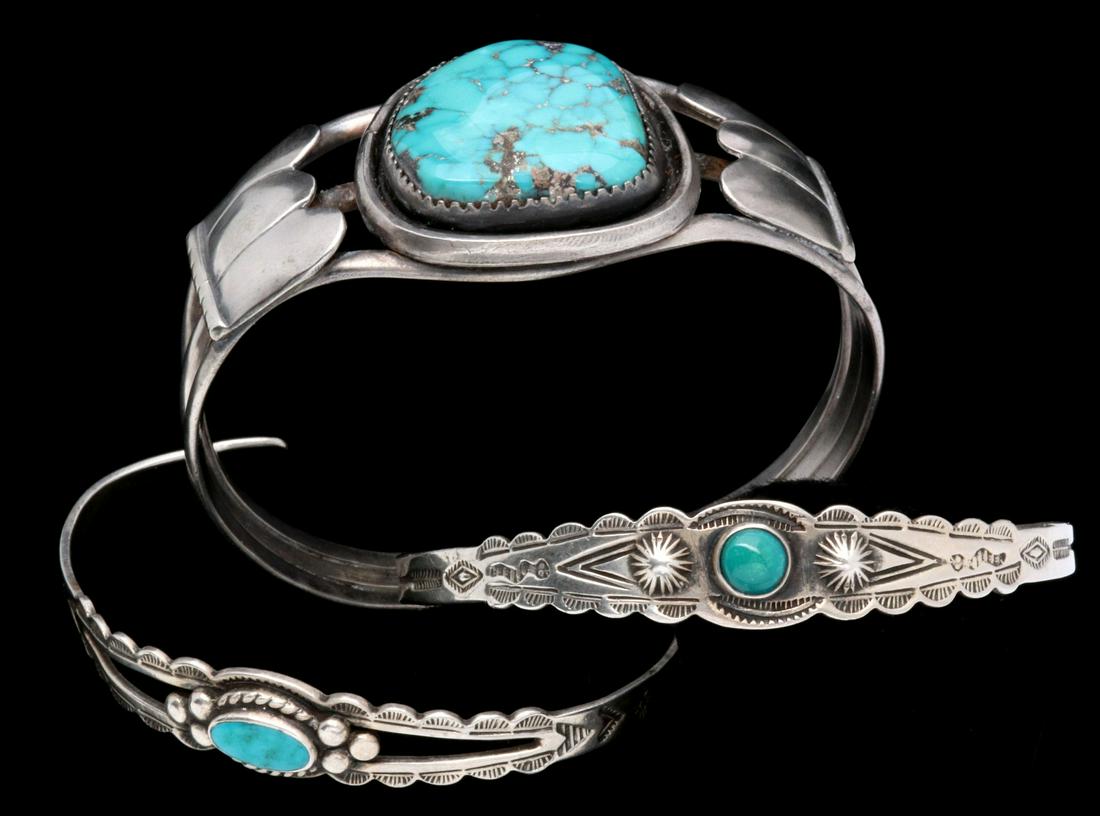 A TRIO OF VINTAGE STERLING NAVAJO BRACELETS (1 of 9)
