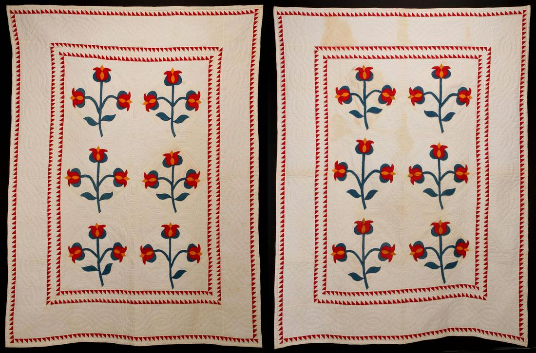 A PAIR OF TWIN SIZE TULIP APPLIQUE QUILTS: Two twin-size quilts in red, green and yellow, satin stitched machine applique on a white background, red and white pieced borders, white backing and binding, elaborate hand quilting. Measure 88 x 66