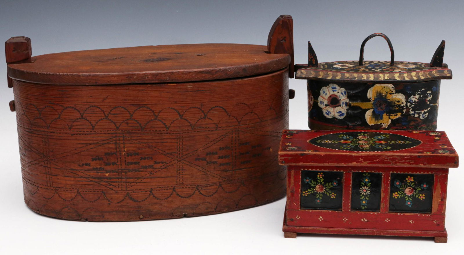 TWO 19TH CENTURY SCANDINAVIAN TINES OR BRIDE: Two bentwood pieces and a third with hinged lid. The larger with simple engraved decoration, nice honey-colored patina. Plus a smaller example with black paint and colorful florals. Lastly, a box in r
