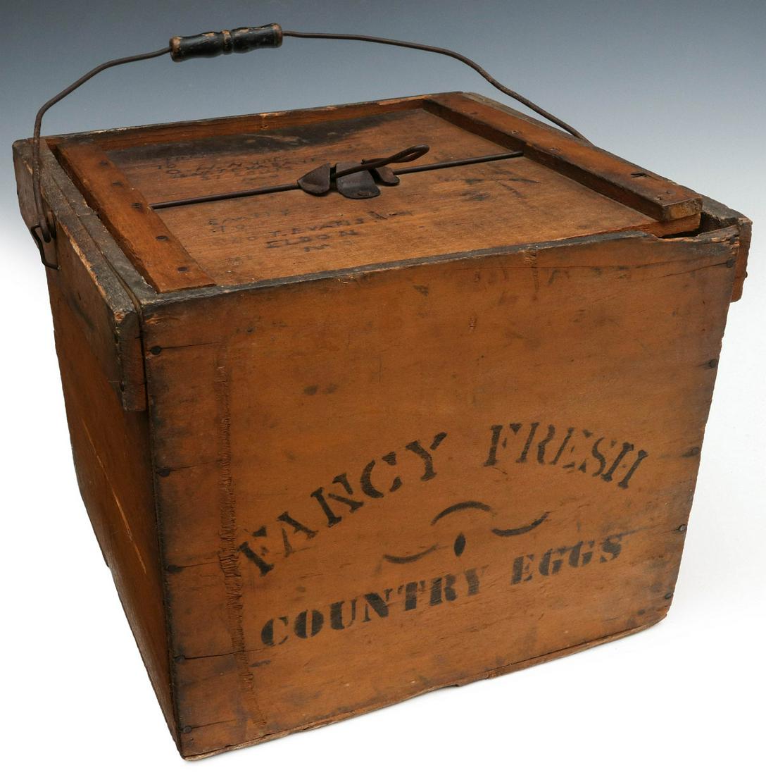 A CIRCA 1900 'FANCY FRESH COUNTRY EGGS' EGG CARRIER: The carrier for a lot of eggs at once with wood handle, old original paint and bail handle with wood grip. Measures 11.75 x 14.5 x 12.5 inches. We happily provide seamless in-house packing and shippin