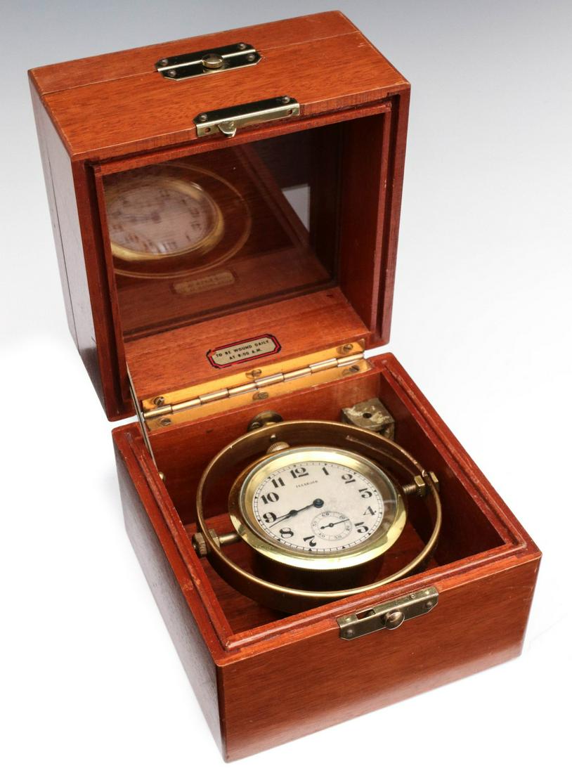 AN ILLINOIS BRAND 21J BUNN SPECIAL MARINE DECK WATCH: The locking two-stage solid mahogany case with piano hinge lid contains a gimbal-mounted movement with brass case, painted metal dial with Arabic numerals, lower seconds bit dial, ILLINOIS signature; 