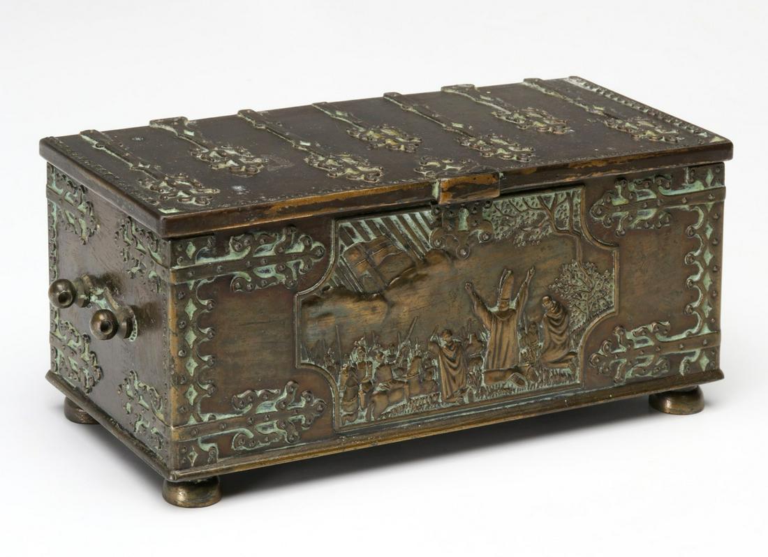 AN IRON ARTS COPENHAGEN DENMARK BRONZE JEWLERY CASKET: The Iron Arts Company bronzed casket of medieval motif, the front panel centered by a vignette of Archbishop Sunesun and the Danish/Estonian battle of Lyndanisse in 1219, embossed maker's mark back pa