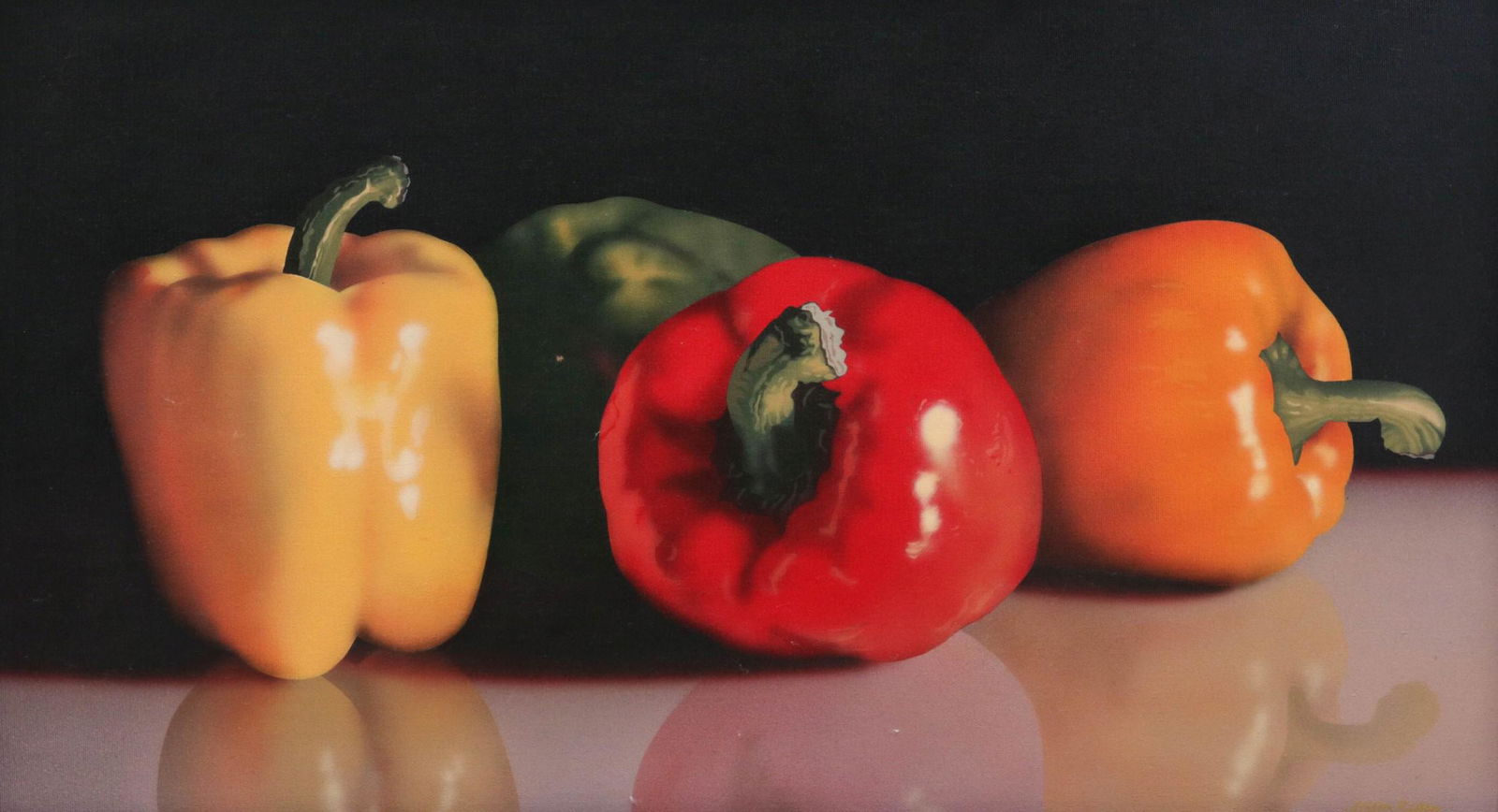 JOHN KUHN (KANSAS, BORN 1948) OIL ON CANVAS: The photo-realist still life of peppers, signed lower right. Canvas measures 16 x 28 with a framed size of 16.75 x 29 inches. We happily provide seamless in-house packing and shipping services on near