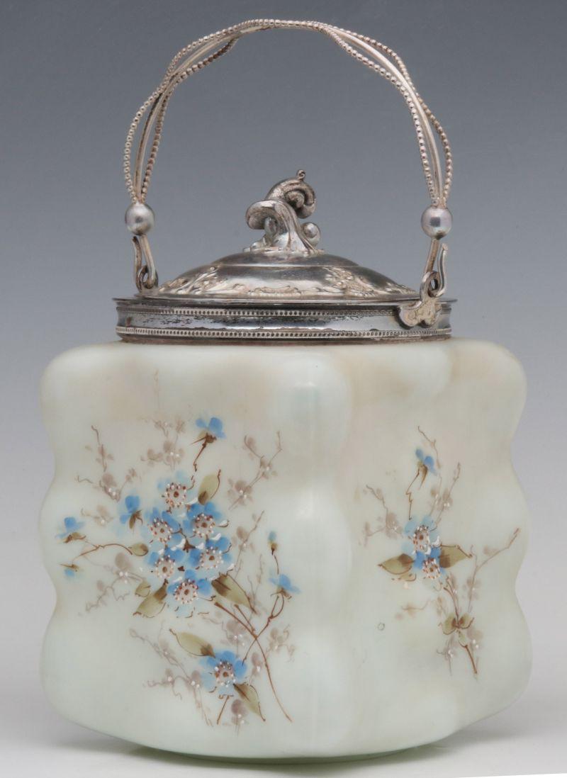 A WAVECREST EGG CRATE VICTORIAN ART GLASS BISCUIT JAR: The egg crate blank with floral decoration and silver plated mounts, unsigned. Measures 8 inches to top of lid or 10 inches to top of handle x 5 x 5. We happily provide seamless in-house packing and s