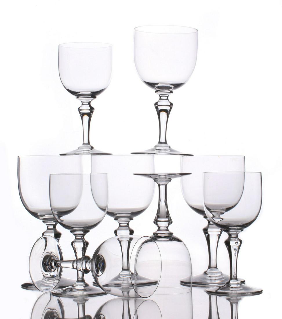 BACCARAT 'NORMANDIE' GOBLETS AND WINE GLASSES: Four tall water goblets and four claret wine glasses, signed by etched marks on the bases. Measures 5.5 x 2.75 to 6.5 x 3.25 inches. We happily provide seamless in-house packing and shipping services 