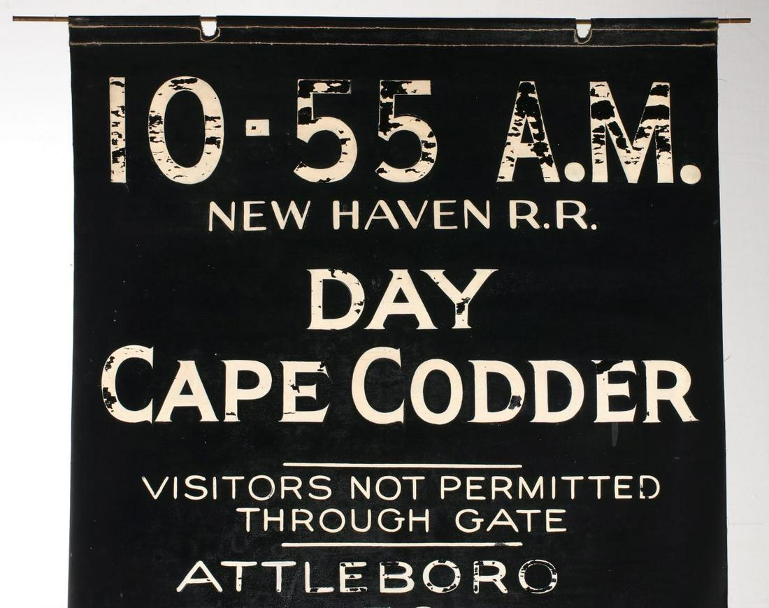 A PAINTED GATE SIGN FOR NEW HAVEN R.R. 'CAPE CODDER': The black coated cloth rolling banner with hand painted lettering in white, brass rod. Measures 24.5 x 64 inches. Provenance: The Collection of Ed McHugh, Massillon, Ohio We happily provide seamless i
