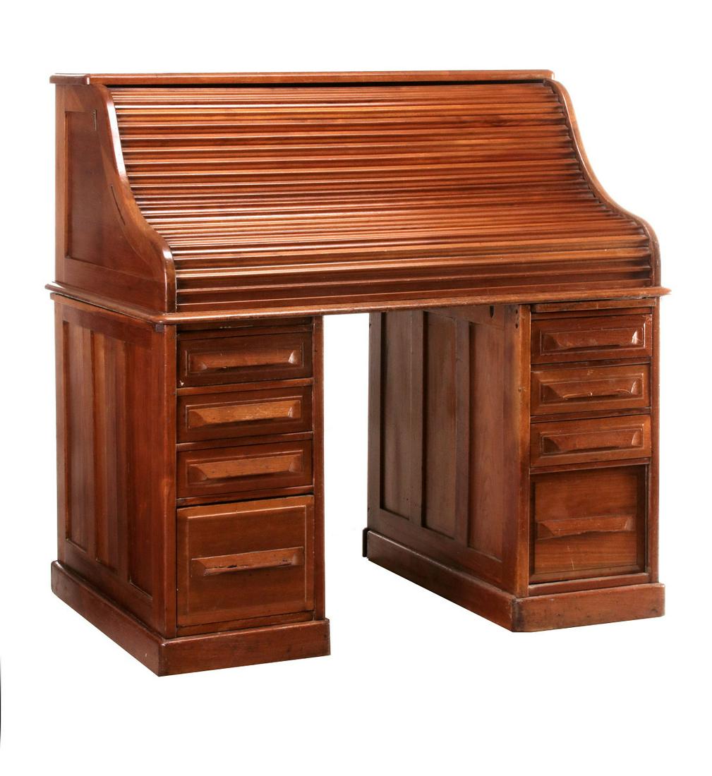 A SMALLER 'S' CIRCA 1900 DESK WITH ROLL TOP: The mixed hardwoods desk with paneled ends and back. Measures 50 x 48 x 31.5 inches. Provenance: The Collection of Ed McHugh, Massillon, Ohio We happily provide seamless in-house packing and shipping
