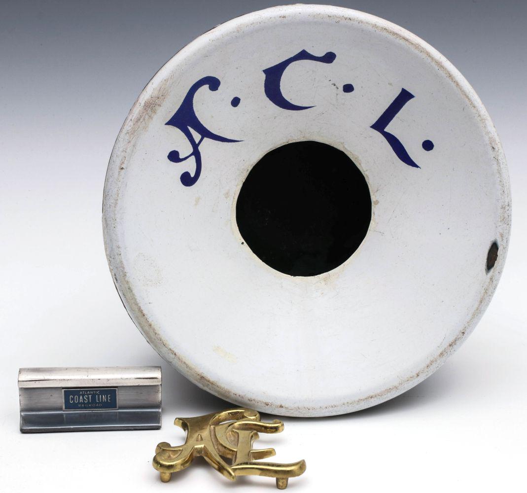 ATLANTIC COAST LINE RR ADVERTISING INCL ENAMEL CUSPIDOR: Three advertising objects for the ACL Railroad including a miniature rail section paperweight, brass trivet and an antique cuspidor with porcelain enamel blue lettering on white. Spittoon measures 3.5