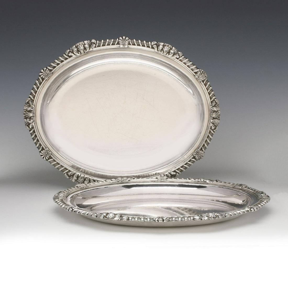 A PAIR MATTHEW BOULTON OLD SHEFFIELD PLATE PLATTERS: A matched pair of oval platters or trays with gadrooned edge and acanthus leaves, maker's mark underside of the rim. Measures 14.5 x 11.25 inches. We happily provide seamless in-house packing and ship