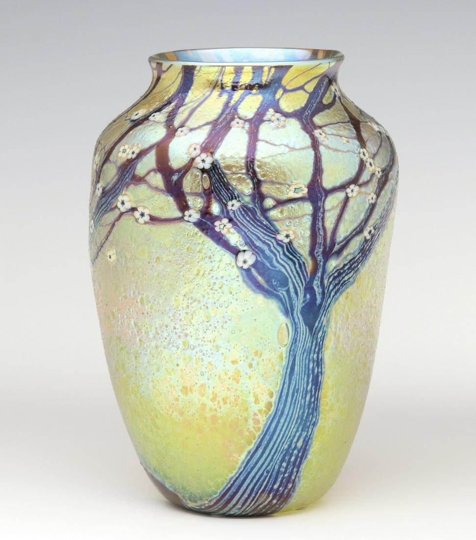 AN ORIENT AND FLUME: The Hawthorn tree overlaid decoration in purple with silvery veins and white flower heads over an iridescent volcanic-like finish, engraved signature underside of the base, original paper label. Measu