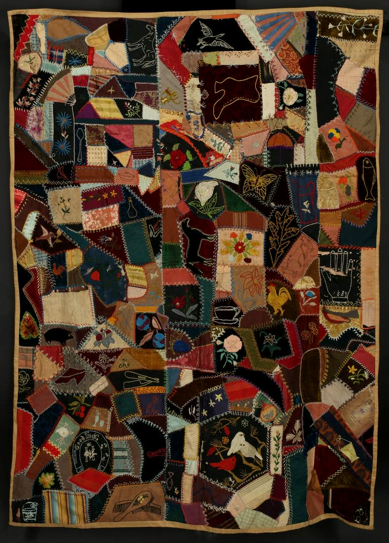A ELABORATELY EMBROIDERED CRAZY QUILT DATED 1884: The pieced, embroidered and appliqued crazy quilt in a variety of velvets, satins, silks and wool in a varied range of patterns, stitches and motifs depicting farm animals, birds, flowers, everyday it