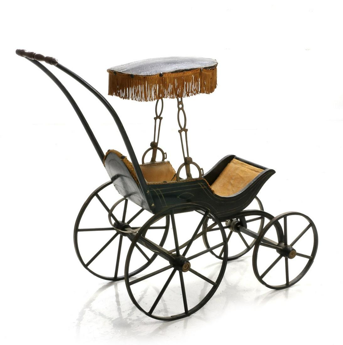 A 19TH CENTURY VICTORIAN SURREY TOP DOLL STROLLER: The high wheel stroller with original paint, decoration and upholstery. Measures 28.5 x 33 x 10.5 inches. We happily provide seamless in-house packing and shipping services on nearly everything we sel