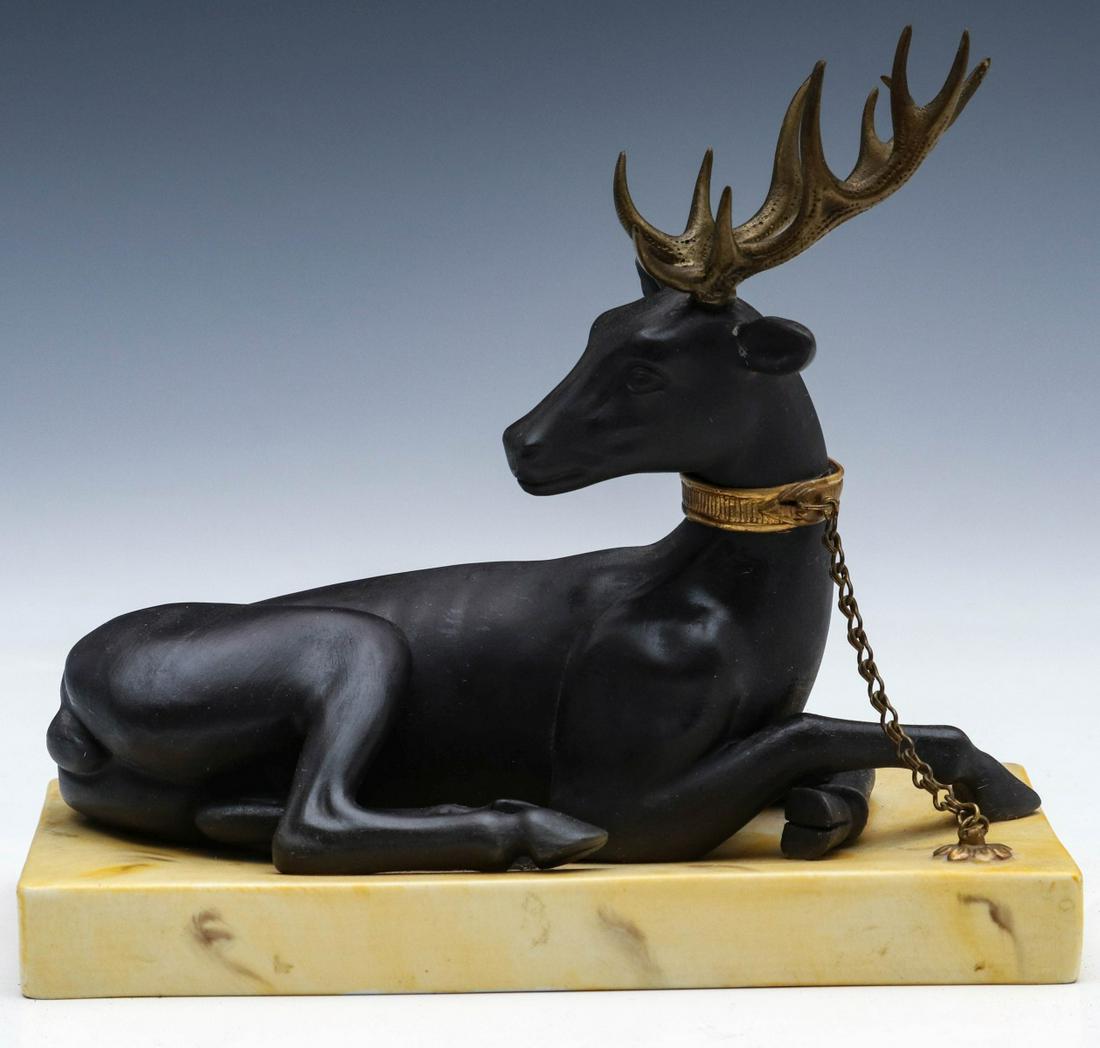 A 19th C. MOTTAHEDAH BLACK BASALT STAG FIGURE: A black basalt figure of a chained stag on a faux marble porcelain base, signed 'Mottahedeh Black Basalt' and marked Italy on the base. Measures 6.5 x 7 x 3.5 inches. We happily provide seamless in-ho