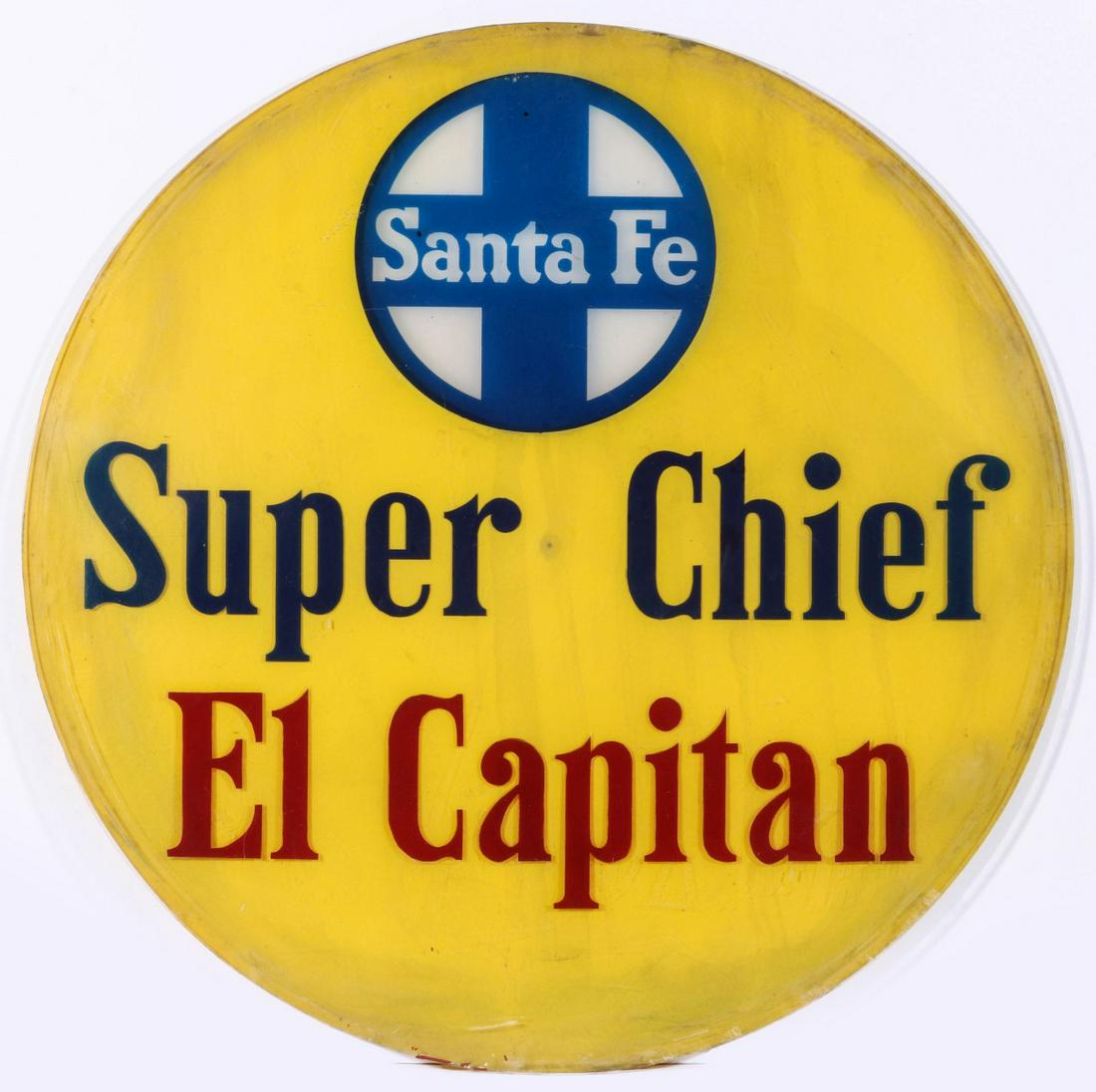 A REVERSE PAINTED SANTA FE SUPER CHIEF DRUM HEAD LENS: The two-piece painted design in five colors with graphics and lettering for the Super Chief El Capitan, premier passenger trains connecting Chicago with Los Angeles. Measures 26 inch diameter. We happ